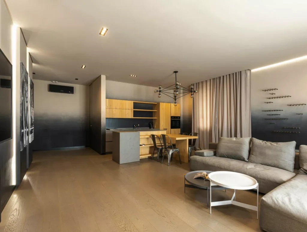 A cozy living room featuring a couch, coffee table, and television, creating a welcoming atmosphere for relaxation.